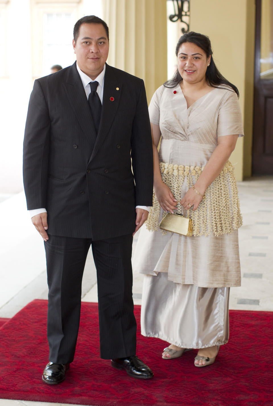 the crown prince standing with a lady