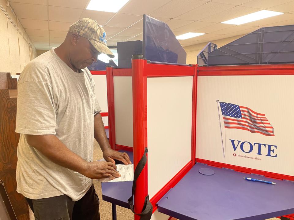 Louis Dixon of Crystal Springs makes his selections for the primary election in Crystal Springs at the J. T. Biggs, Jr. Memorial Library where poll workers reported a light Republican turnout, but higher than average Democratic turnout.