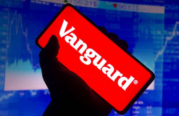 PHOTO: In this photo illustration the Vanguard Group logo displayed on a smartphone screen and a stock market graph in the background. (Rafael Henrique/Getty Images)