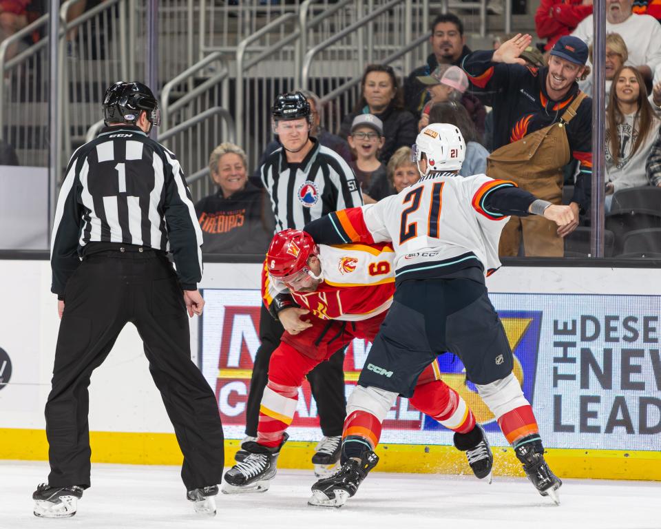 A heated scuffle erupts on the ice as Peetro Seppala (6) and Ian McKinnon (21) engage in a tussle during the game at Acrisure Arena in Thousand Palms, CA, on November 11, 2023.