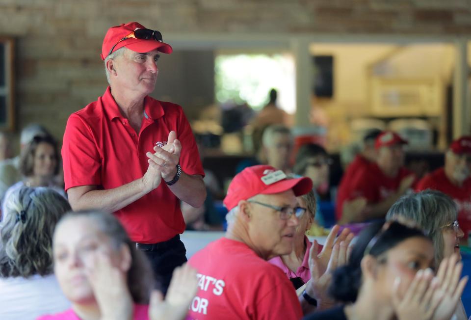 Volunteers are recognized for reaching the 25 years of service milestone during an event celebrating Greater Fox Cities Area Habitat for Humanity 30th year on Thursday in Menasha.