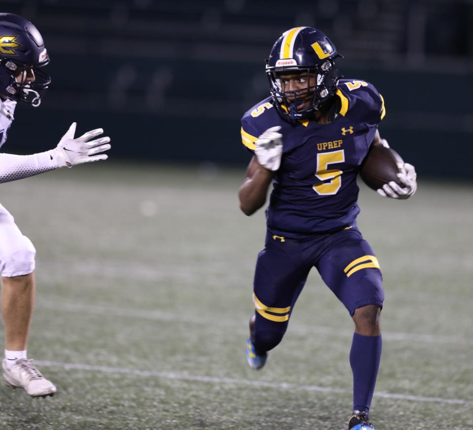 UPrep Juelz Russell keeps his eye on a Victor High player coming towards him during the football game at Rochester Community Sports Complex in Rochester, NY on September 2, 2022.