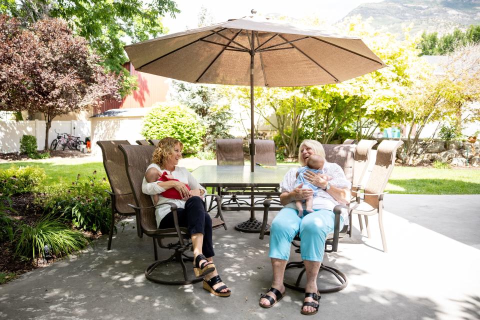 Cindy Davis and her mother Camie Bishop Calaway sit together in Davis’ yard while babysitting 9-week-old twins Indy and Oakley, who are Davis’ granddaughters and Calaway’s great-granddaughters, in Cedar Hills on Tuesday, Aug. 15, 2023. | Spenser Heaps, Deseret News