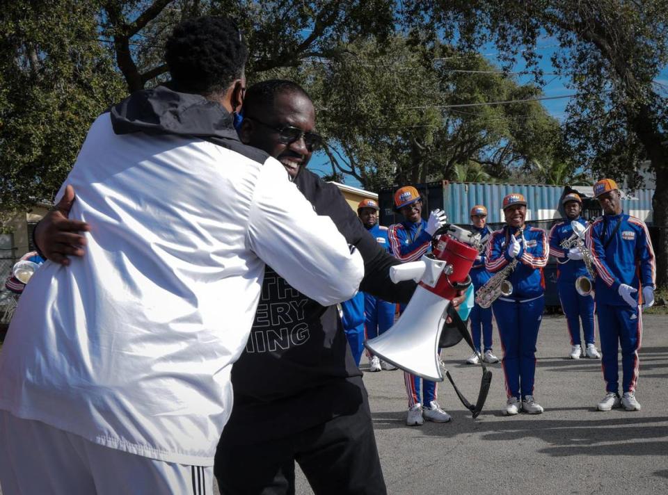 FMU band director Richard Beckford thanks Fedrick C. Ingram of the American Federation of Teachers, center, after addressing the Florida Memorial University Marching Band prior to their participation in the MLK parade in MIami. The 45th Annual MLK Parade traveled westbound on Northwest 54th Street starting on 12th Avenue on Martin Luther King Jr. Day, Jan, 17, 2022.