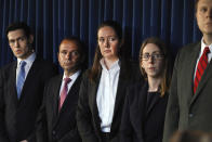 Assistant U.S. Attorney Maurene Comey, center, daughter of former FBI Director James Comey, listens during a news conference, in New York, Monday, July 8, 2019. Federal prosecutors announced sex trafficking and conspiracy charges against wealthy financier Jeffrey Epstein. Court documents unsealed Monday show Epstein is charged with creating and maintaining a network that allowed him to sexually exploit and abuse dozens of underage girls.(AP Photo/Richard Drew)