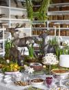 <p>If you opt for a buffet display table, go big with decorations. Deer or turkeys make for a fun and whimsical display and can be utilized with easy swaps for both Thanksgiving and Christmas.</p>