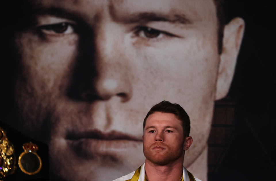 ARLINGTON, TEXAS - MAY 06:  Canelo Alvarez looks on against Billy Joe Saunders during the press conference for Alvarez's WBC and WBA super middleweight titles and Saunders' WBO super middleweight title at Live! by Loews hotel on May 06, 2021 in Arlington, Texas. (Photo by Al Bello/Getty Images)