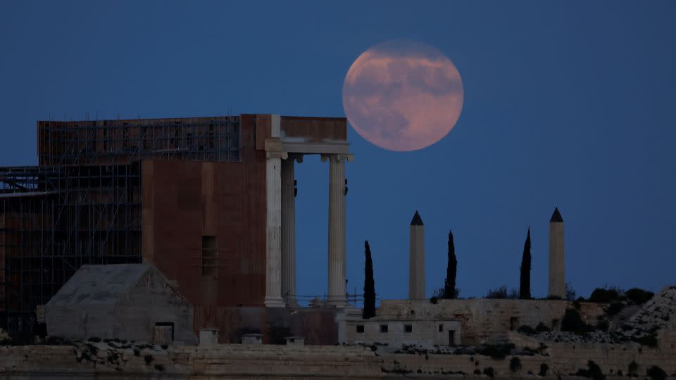 A hunter's moon rises behind the set for director Ridley Scott's upcoming film, "Gladiator II," at Fort Ricasoli in Kalkara, Malta, at the entrance to Valletta's Grand Harbour in October 2023. - Darrin Zammit Lupi/Reuters