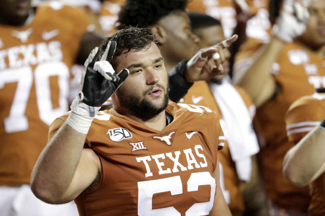 AUSTIN, TX - SEPTEMBER 21:  Samuel Cosmi #52 of the Texas Longhorns celebrates with teammates after the game against the Oklahoma State Cowboys at Darrell K Royal-Texas Memorial Stadium on September 21, 2019 in Austin, Texas.  (Photo by Tim Warner/Getty Images)