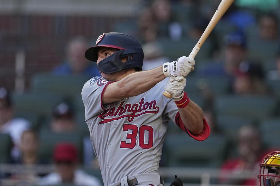 Washington Nationals' Jacob Young (30) puts the Nationals ahead with a two-run base hit in the ninth inning of a baseball game against the Atlanta Braves, Sunday, Oct. 1, 2023, in Atlanta. (AP Photo/John Bazemore)