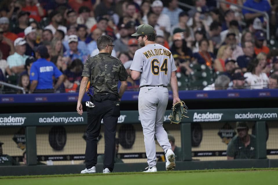 Oakland Athletics starting pitcher Ken Waldichuk (64) leaves during the sixth inning of a baseball game against the Houston Astros Friday, May 19, 2023, in Houston. (AP Photo/David J. Phillip)