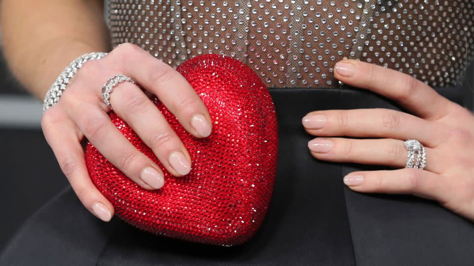 Juno Temple's heart-shaped clutch. - Danny Moloshok/Invision/AP