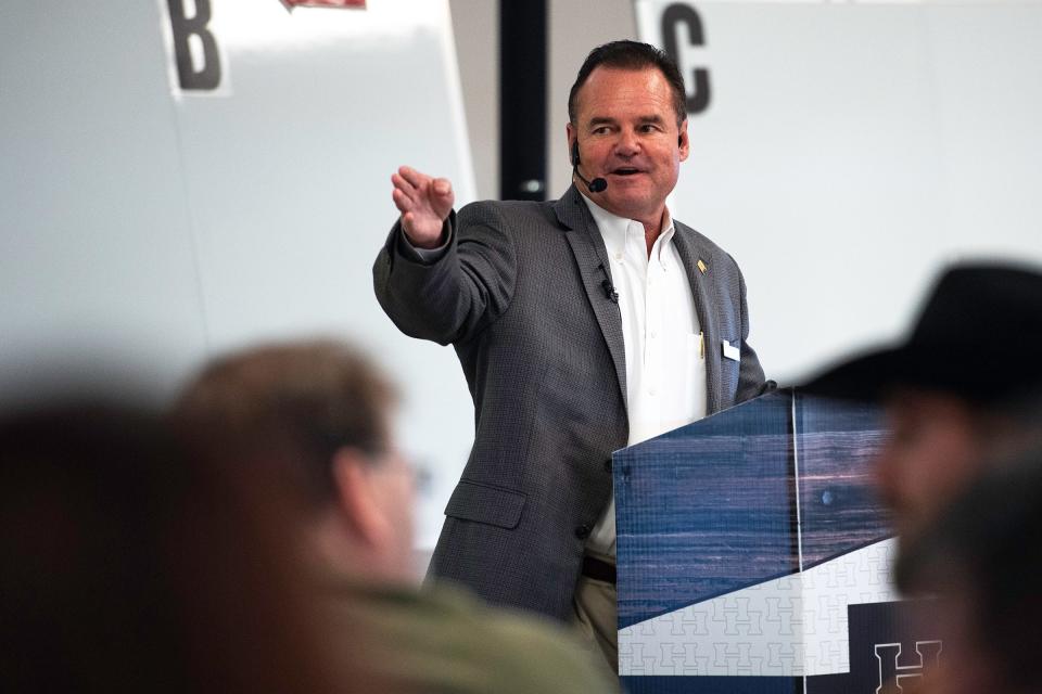 Scott Shuman of Hall & Hall Auctions calls out a bid during an auction at the Boulder County Fairgrounds in Longmont on Wednesday.