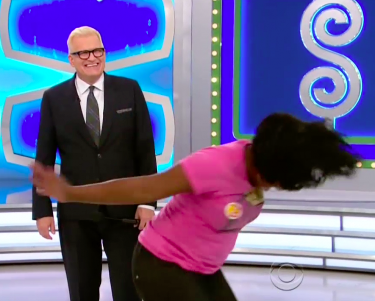 A contestant celebrates getting onstage on The Price Is Right.