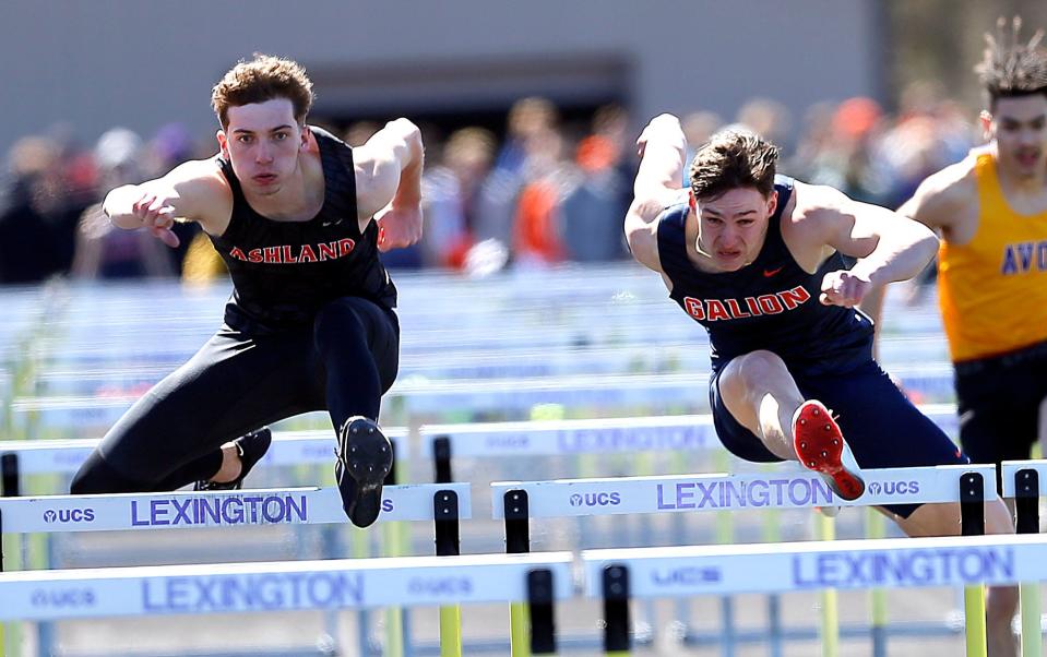 Ashland’s Braydon Martin and Galion’s Link Terrell compete in 110 meter hurdles the during the 49th Lexington Track & Field Invitational Saturday, April 6, 2024 at Lexington High School. TOM E. PUSKAR/MANSFIELD NEWS JOURNAL