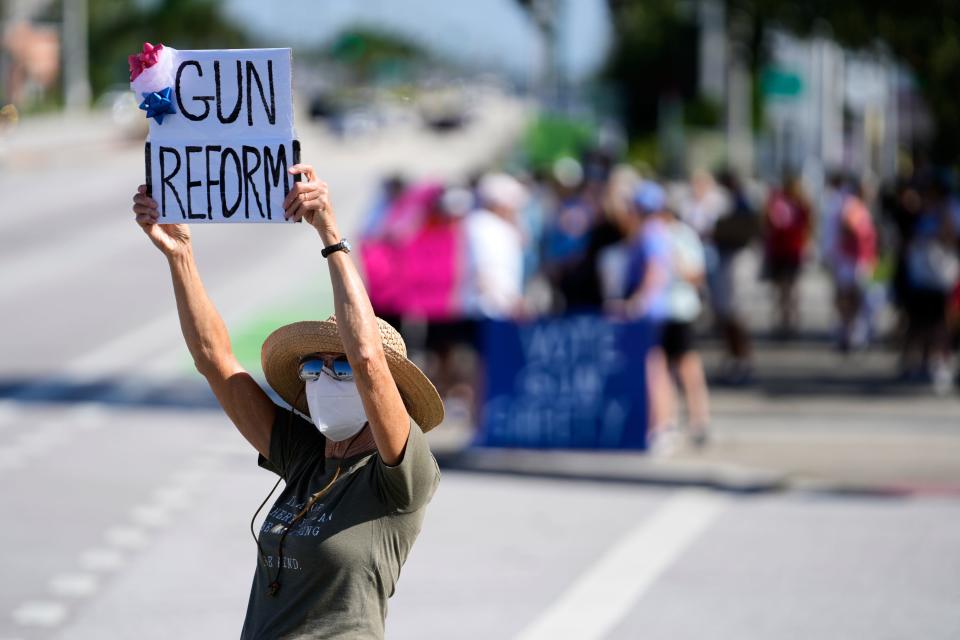 In a June 11, 2022, photo, Sharon Garland, of Hobe Sound, participates in March For Our Lives nationwide protest on the Roosevelt Bridge in Stuart in response to the Uvalde, Texas, school shooting. March For Our Lives is a youth-led movement dedicated to promoting civic engagement, education, and direct action by youth to eliminate the epidemic of gun violence.