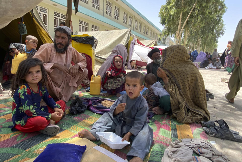 Internally displaced Afghans who fled their home due to fighting between the Taliban and Afghan security personnel, are seen at a camp in Daman district of Kandahar province south of Kabul, Afghanistan, Thursday, Aug. 5, 2021. (AP Photo/Sidiqullah Khan)