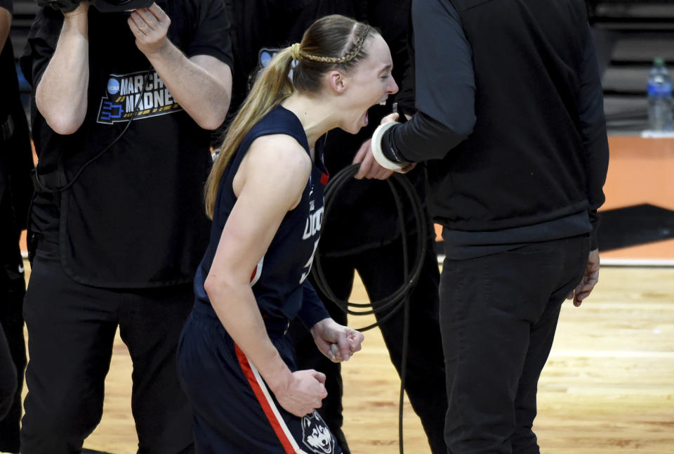 UConn guard Paige Bueckers celebrates after winning an Elite Eight college basketball game against Southern California in the women's NCAA Tournament, Monday, April 1, 2024, in Portland, Ore. (AP Photo/Steve Dykes)