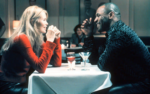 Claudia Schiffer and Mike Tyson in 1999's Black and White - Credit: EPA