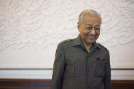 Malaysia's former Prime Minister Mahathir Mohamad poses for a picture during an interview with The Associated Press at his office in Kuala Lumpur, Malaysia, Friday, Aug. 19, 2022. Mahathir expects Malaysia’s graft-tainted ruling party will hold general elections in coming months, and could win big, but the nonagenarian reformer vowed Friday that he would fight "even a losing battle" on principle. (AP Photo/Vincent Thian)