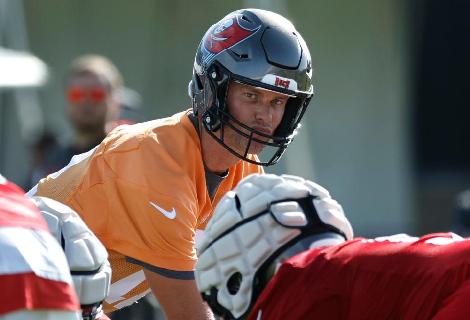 Tampa Bay Buccaneers quarterback Tom Brady (12) looks on during training camp at Advent Health Training Complex.