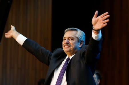 FILE PHOTO: Argentina's presidential candidate Alberto Fernandez waves before a meeting with students and teachers at Faculty of Exact and Natural Sciences, University of Buenos Aires