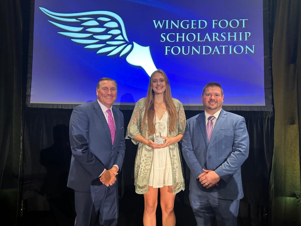 St. John Neumann's Sophia McCartney poses with Dan Mullen (left) and Buddy Hornbeck (right) after being named the recipient of the Winged Foot Scholarship on Friday, May 10th, 2024.