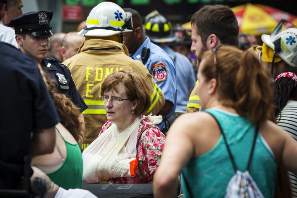 Double-decker tour buses collide in Times Square