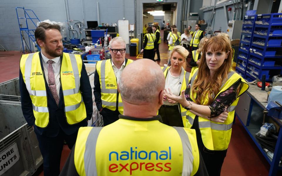 Angela Rayner (right) and Louise Haigh (second right) are pictured today during a visit to Perry Barr bus depot in Birmingham