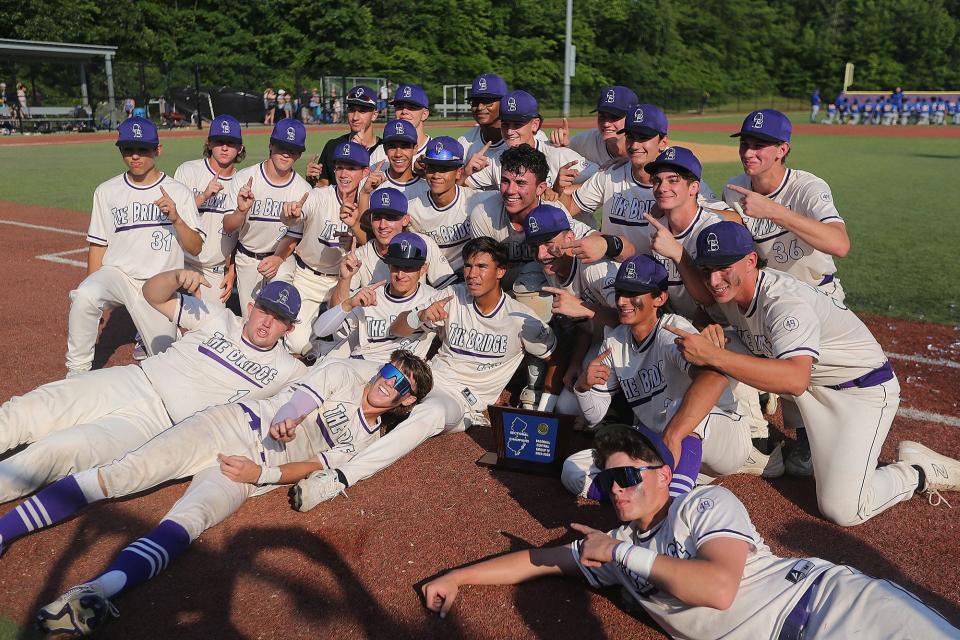 The Old Bridge baseball players pose after winning the Central Group 4 championship on June 2, 2023