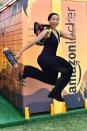 Kat Graham jumps for joy at the Amazon Lockers during Coachella weekend two on Friday.