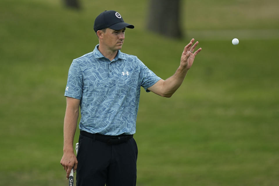 Jordan Spieth tosses his ball to his caddie on the fifth hole during the second round of the Dell Technologies Match Play Championship golf tournament in Austin, Texas, Thursday, March 23, 2023. (AP Photo/Eric Gay)