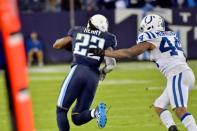 Oct 16, 2017; Nashville, TN, USA; Tennessee Titans running back Derrick Henry (22) rushes 72 yards for a touchdown against Indianapolis Colts inside linebacker Antonio Morrison (44) during the second half at Nissan Stadium. Mandatory Credit: Jim Brown-USA TODAY Sports