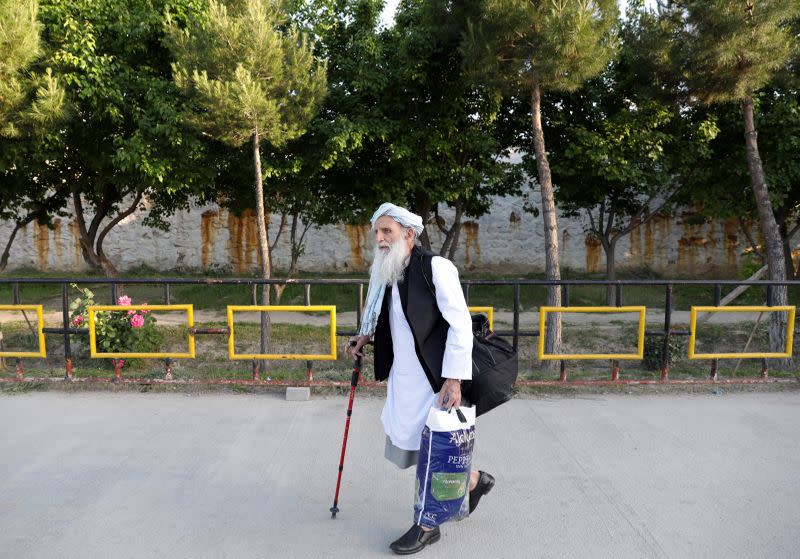 A newly freed Taliban prisoner walks at Pul-i-Charkhi prison, in Kabul, Afghanistan