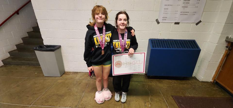 Northeastern freshman Olivia Crull and senior Heather Crull after the IHSGW State Finals in Kokomo on Friday, Jan. 12, 2024. Heather won the championship at 105 pounds, while Olivia was third at 110. It's the first state championship for any Northeastern wrestler in school history.