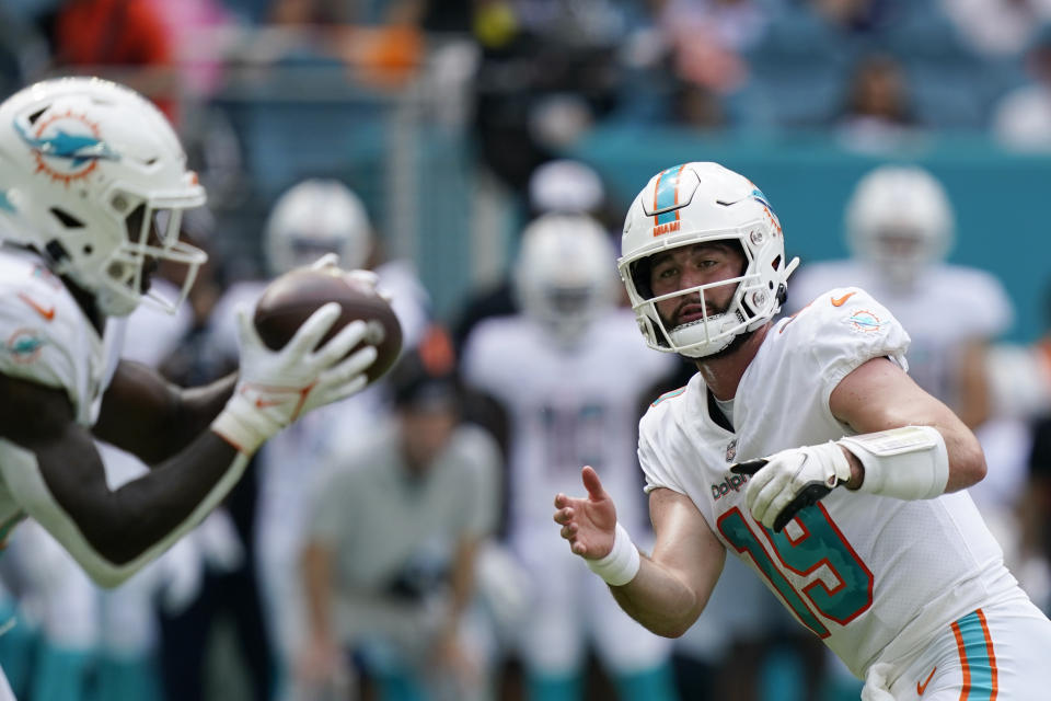 Miami Dolphins quarterback Skylar Thompson (19) tosses a short pass during the first half of an NFL football game against the Minnesota Vikings, Sunday, Oct. 16, 2022, in Miami Gardens, Fla. (AP Photo/Lynne Sladky)