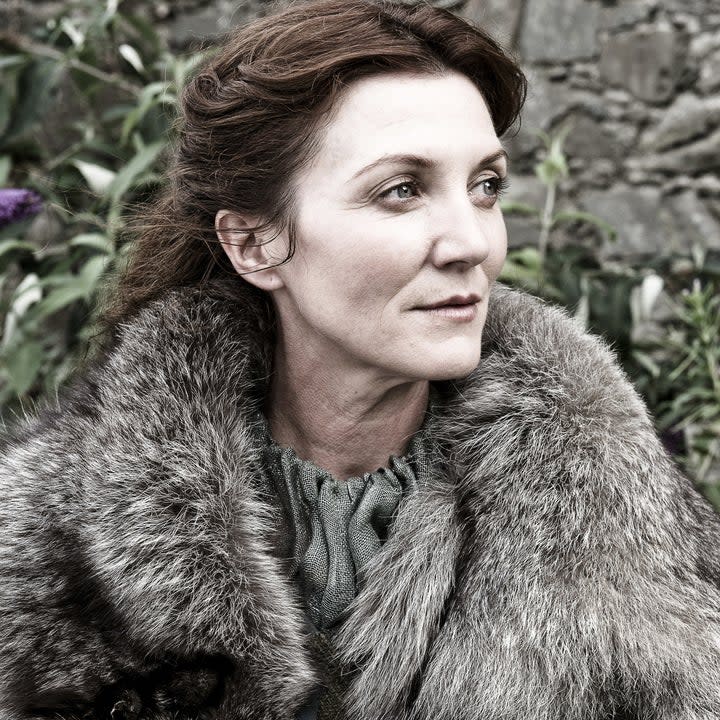 Michelle Fairley wearing fur