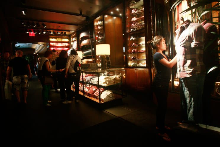 Abercrombie & Fitch stores, like their sister store, Hollister, were known for being dimly lit, incredibly loud, and offensively pungent. (Photo: Getty Images)