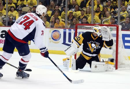 May 4, 2016; Pittsburgh, PA, USA; Washington Capitals defenseman John Carlson (74) scores a goal against Pittsburgh Penguins goalie Matt Murray (30) during the second period in game four of the second round of the 2016 Stanley Cup Playoffs at the CONSOL Energy Center. Mandatory Credit: Charles LeClaire-USA TODAY Sports