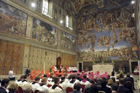 Pope Benedict XVI conduct Vespers in the Sistine Chapel at the Vatican, October 31, 2012. REUTERS/Osservatore Romano/Pool