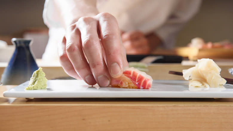 Chef serving omakase