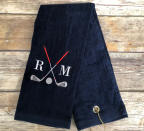 <p>It gets hotter than hot on the golf course, and a glass of lemonade only does so much. For the rest of the sweaty heat, a monogrammed golf towel will do the trick. </p> <p><strong>Buy It: $18;<em> <a href="https://www.awin1.com/cread.php?awinmid=6220&awinaffid=272513&clickref=SL20GolfGiftIdeasForDadThatAreGuaranteedToBeaHoleInOnesimsjGifGal7841367202006I&p=https%3A%2F%2Fwww.etsy.com%2Flisting%2F679298761%2Fpersonalized-golf-towel-golf-towel-golf" rel="sponsored noopener" target="_blank" data-ylk="slk:etsy.com;elm:context_link;itc:0;sec:content-canvas" class="link ">etsy.com</a></em></strong></p>