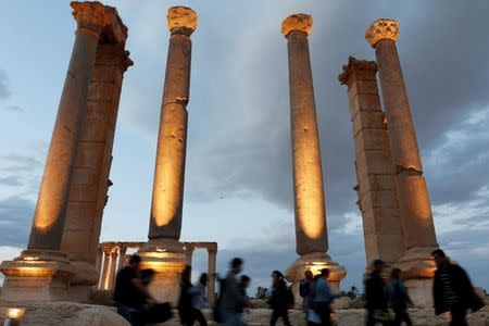 People visit the ruins of the historic city of Palmyra ahead of a musical event at its amphitheatre, Syria May 6, 2016. REUTERS/Omar Sanadiki/Files