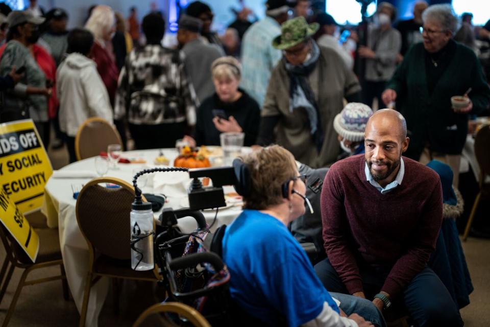 Democratic candidate for U.S. Senate Mandela Barnes greets attendees at a "Fish Fry to Save Social Security" event