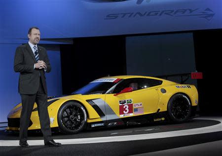 Daniel Ammann, President of GM, speaks next to the Chevrolet Corvette Stingray C7R racing version during the press preview day of the North American International Auto Show in Detroit, Michigan January 13, 2014. REUTERS/Rebecca Cook