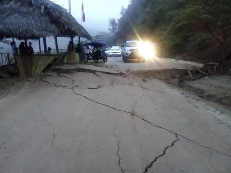 In this photo courtesy of Hoy Noticias media, a road is left cracked after a magnitude 8.0 earthquake in San Martin, Peru, Sunday, May 26, 2019. The powerful quake struck a remote part of the Amazon jungle in Peru early Sunday, collapsing buildings and knocking out power to some areas. (Hoy Noticias via AP)