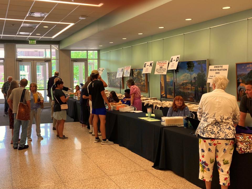 Attendees arrive Wednesday afternoon at the Emens Auditorium lobby for the United Methodist Churches of Indiana Annual Conference hosted at Ball State University. The event will run through Saturday. About 1,200 people were expected.