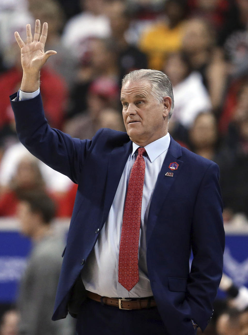 San Diego State coach Brian Dutcher gestures during the first half of the team's NCAA college basketball game against Boise State in the Mountain West Conference men's tournament Friday, March 6, 2020, in Las Vegas. (AP Photo/Isaac Brekken)