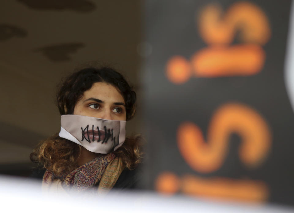 Protesters stage a demonstration outside a court house in Paralimni, Cyprus on Monday, December 30, 2019, in support of a 19 year-old British woman who was found guilty of fabricating claims that she was gang raped by 12 Israelis. Announcing his verdict, Judge Michalis Papathanasiou said the defendant didn't tell the truth and tried to deceive the court with "convenient"and "evasive" statements in court. She is due to be sentenced on Jan. 7.(AP Photo/Philippos Christou)