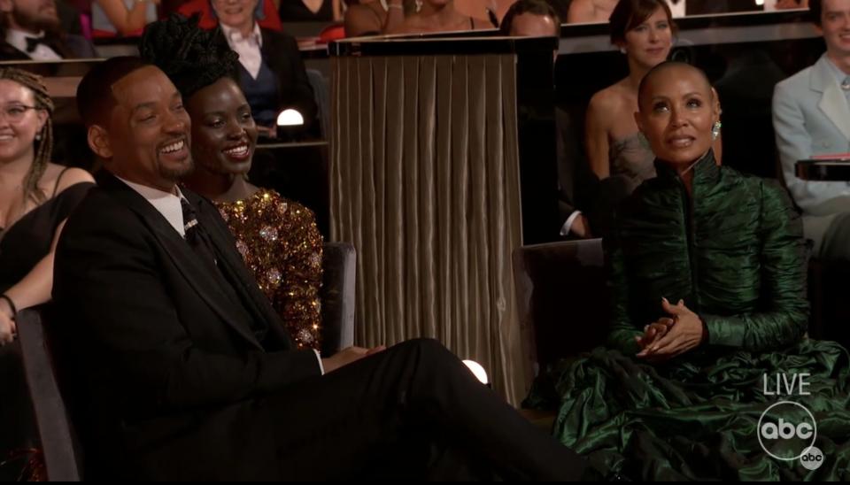 Will Smith and Jada Pinkett Smith sit in the audience during the 2022 Oscars.